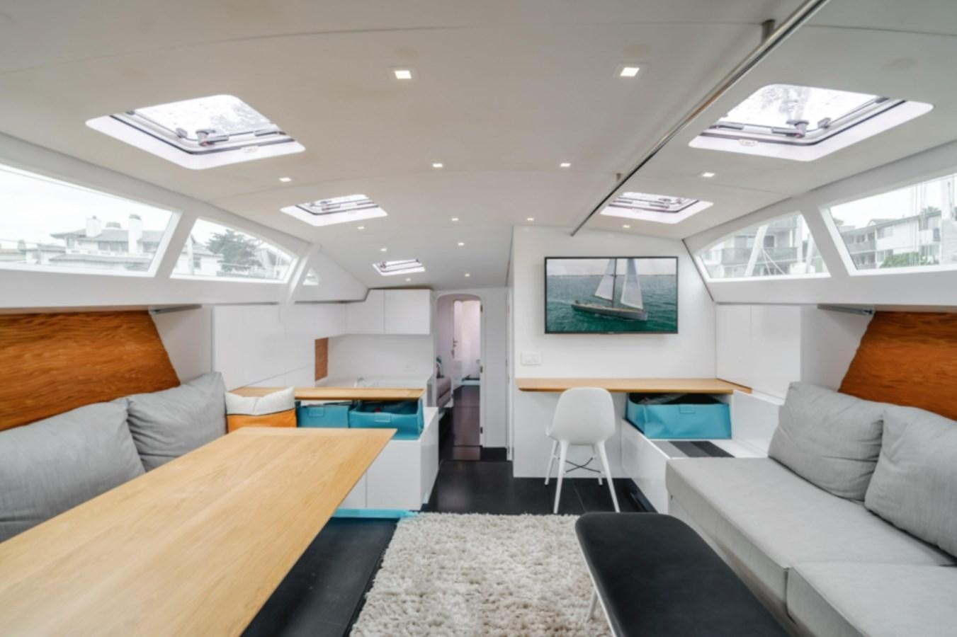 a room with couches and a table aboard AANDEEL Yacht for Sale