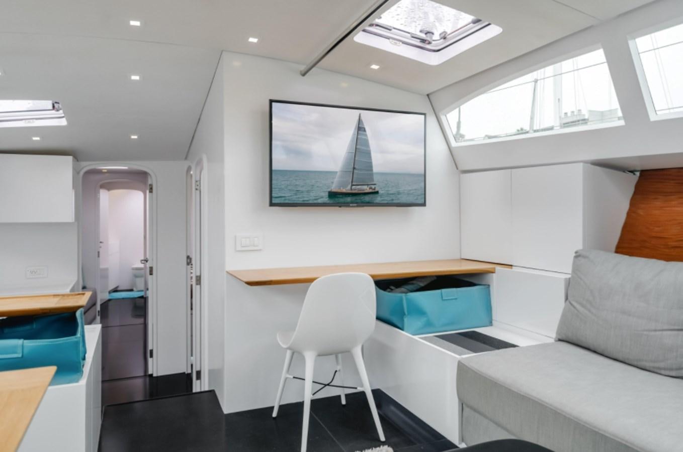 a room with a couch and a table aboard AANDEEL Yacht for Sale