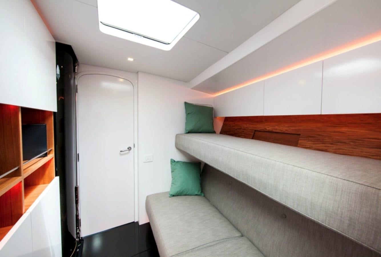 a room with a couch and a television aboard AANDEEL Yacht for Sale