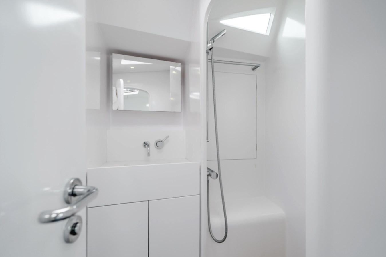 a bathroom with a shower unit aboard AANDEEL Yacht for Sale