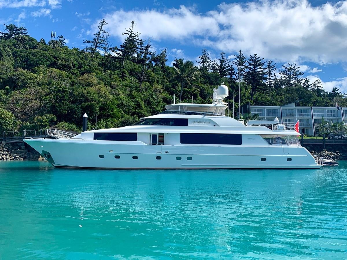 a white yacht in a body of water aboard SIMPLICITY Yacht for Sale