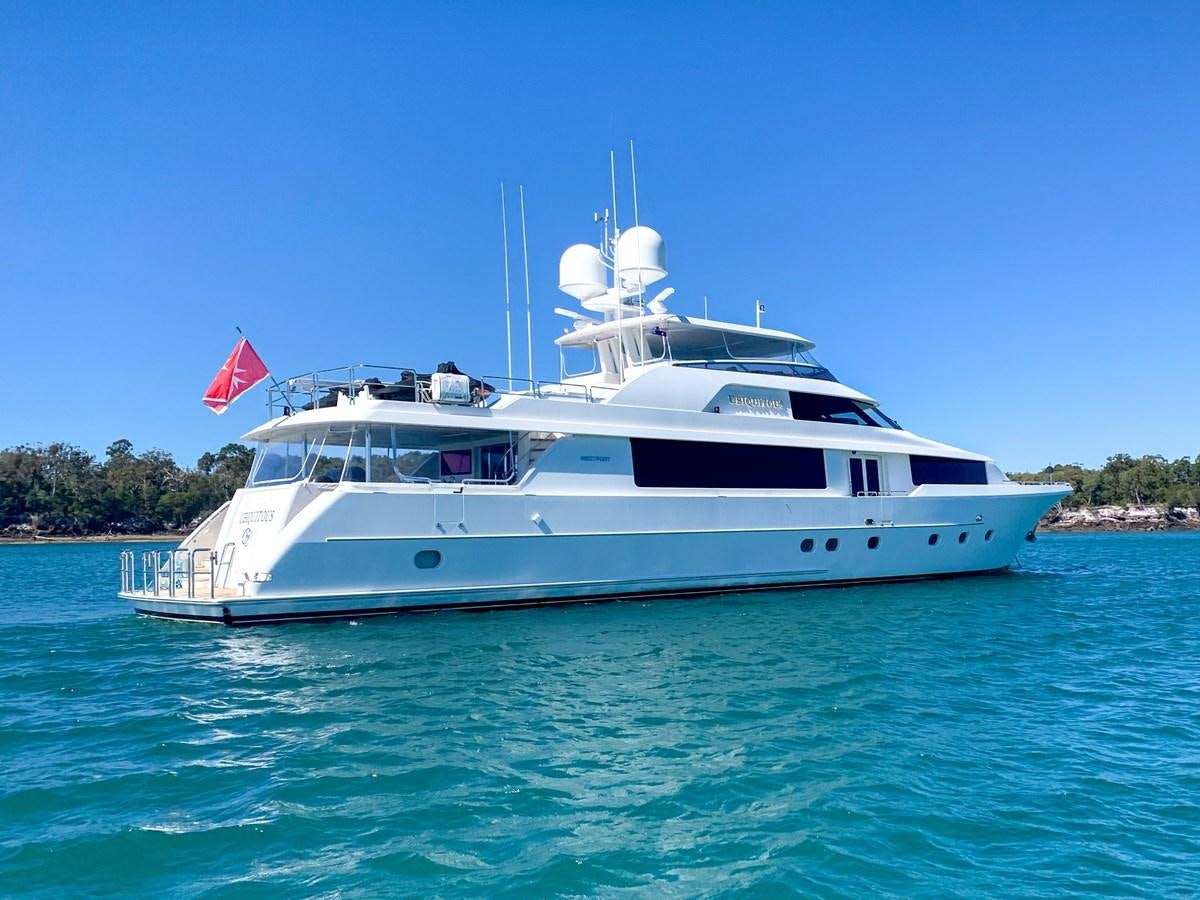 a white yacht on the water aboard SIMPLICITY Yacht for Sale