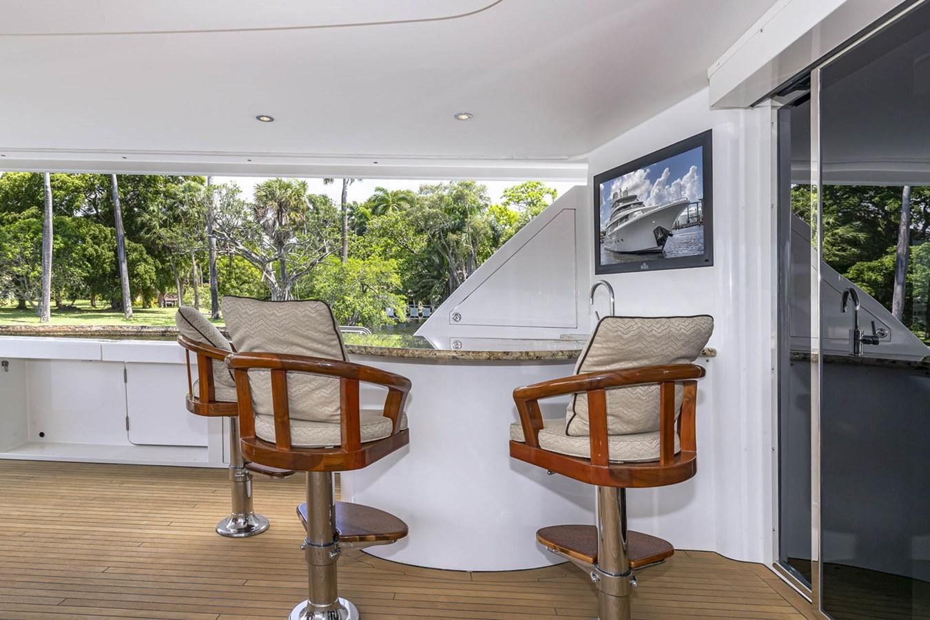 a room with a table and chairs aboard SIMPLICITY Yacht for Sale