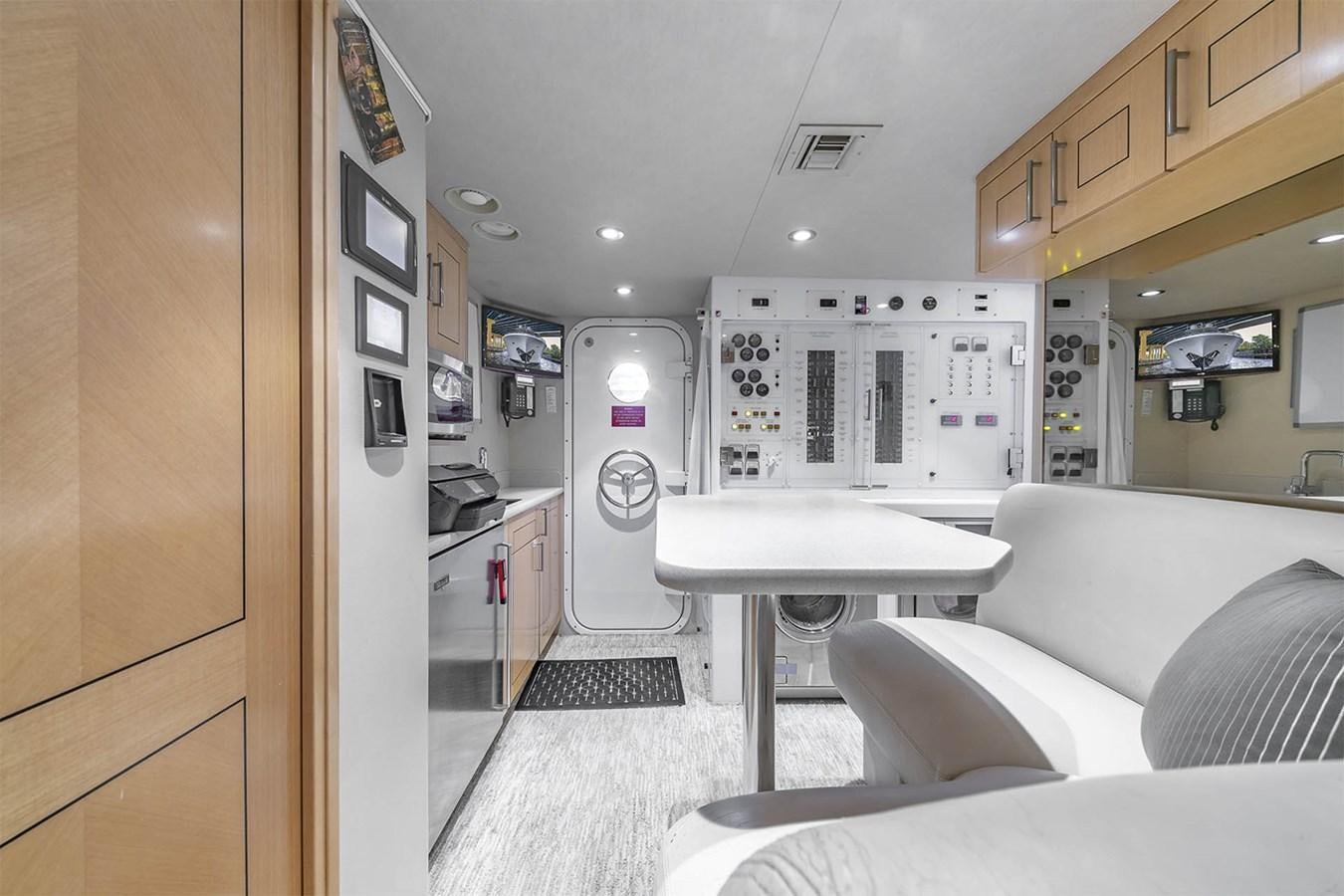 a room with a bed and a couch aboard SIMPLICITY Yacht for Sale