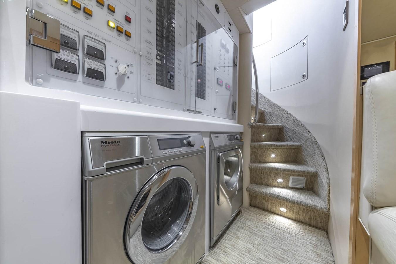 a room with washer and dryer aboard SIMPLICITY Yacht for Sale