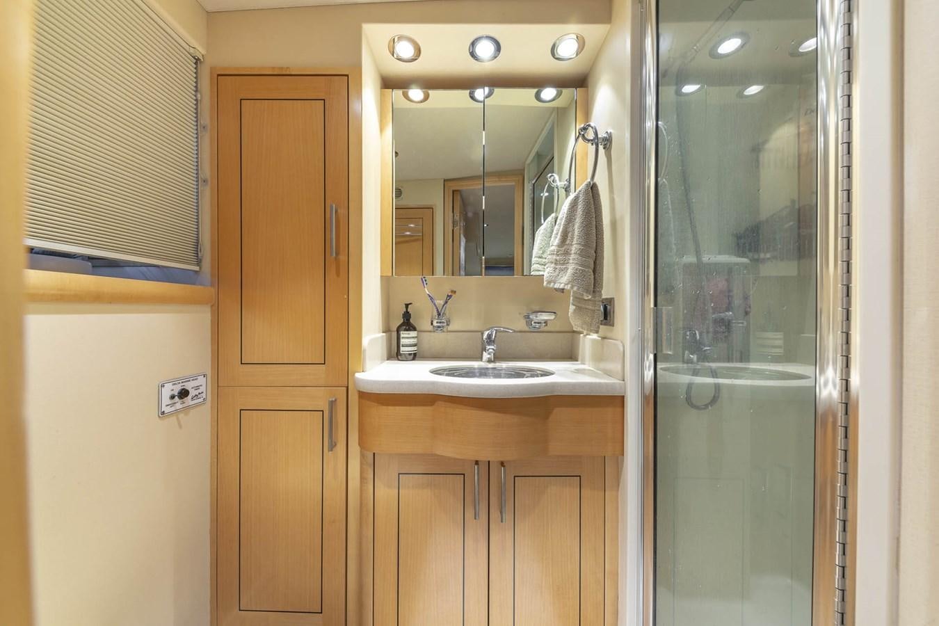 a bathroom with a glass shower aboard SIMPLICITY Yacht for Sale
