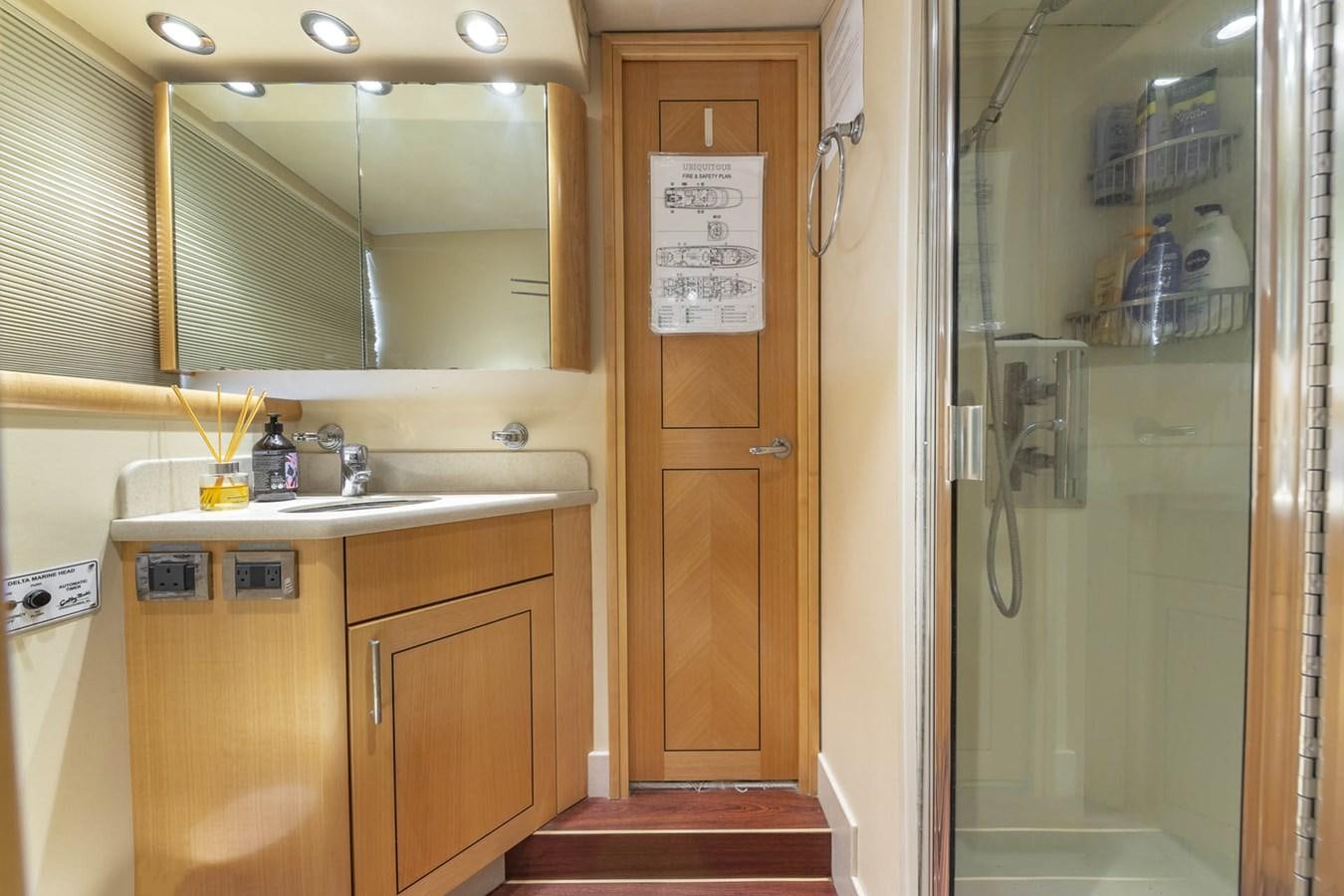 a bathroom with a sink and a mirror aboard SIMPLICITY Yacht for Sale
