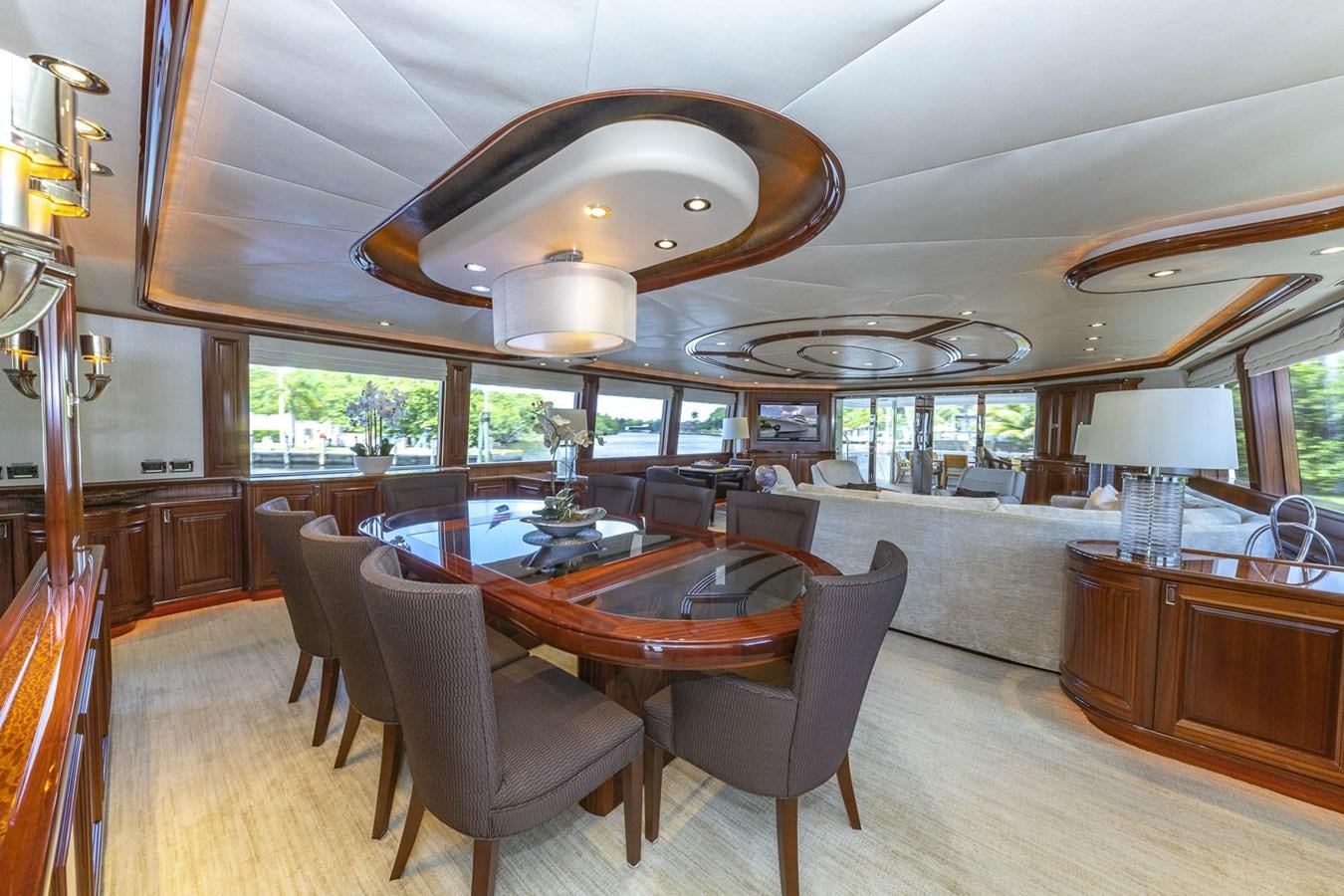 a large kitchen with a dining table aboard SIMPLICITY Yacht for Sale