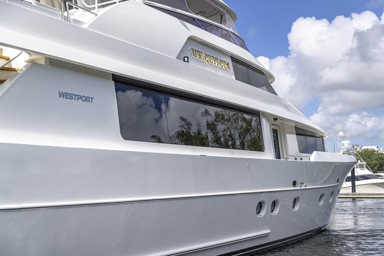 a white boat with a dog's face on the front aboard SIMPLICITY Yacht for Sale