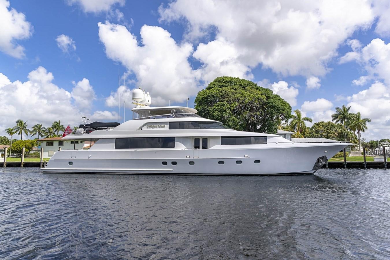 a white yacht on the water aboard SIMPLICITY Yacht for Sale