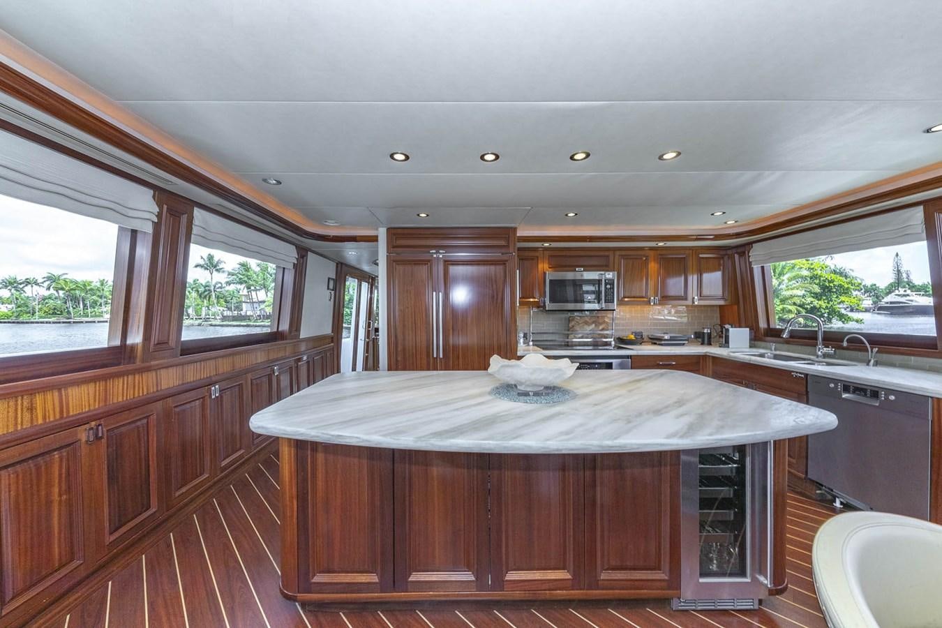 a kitchen with a large island aboard SIMPLICITY Yacht for Sale