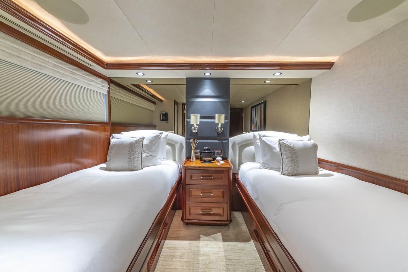 a room with two beds aboard SIMPLICITY Yacht for Sale