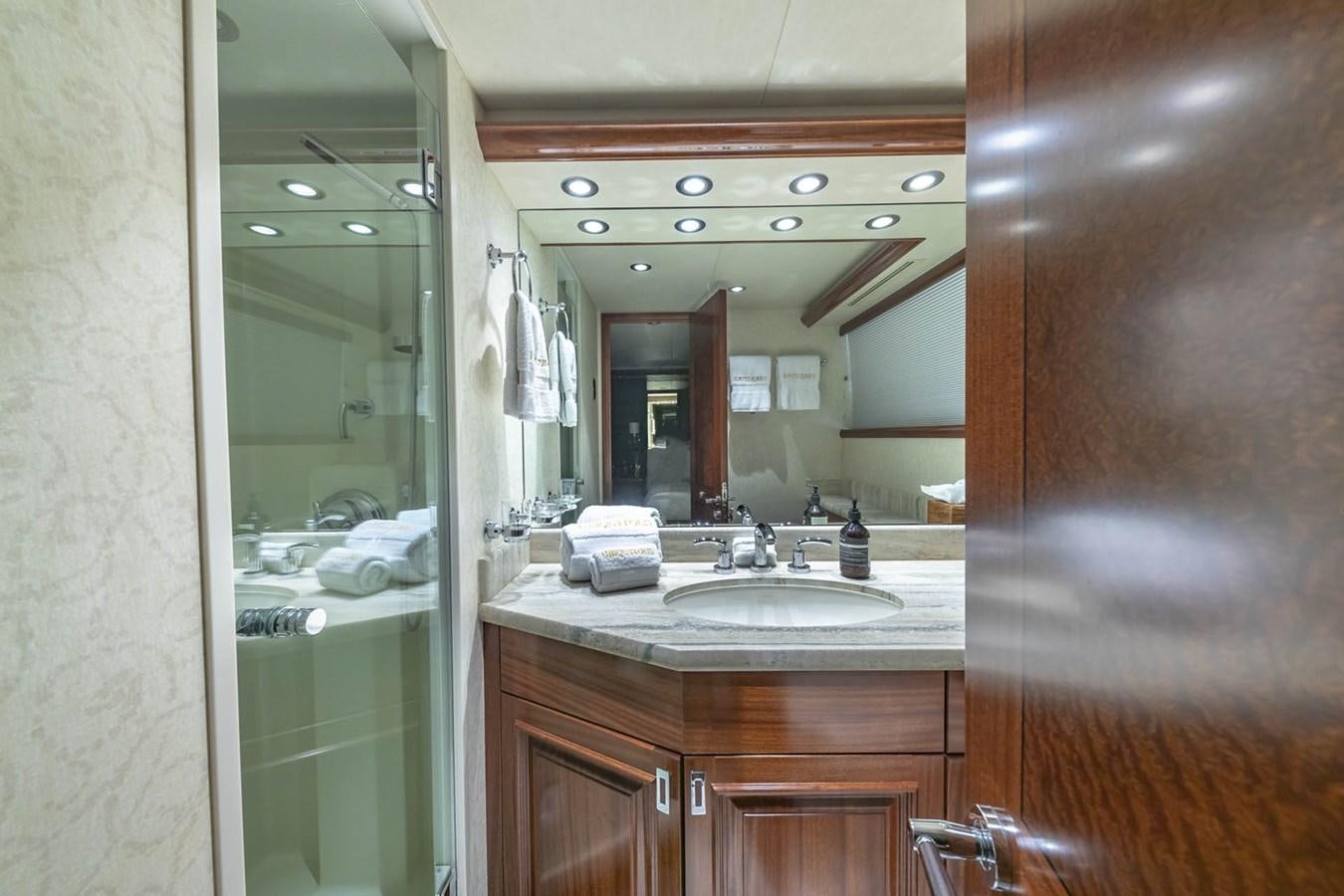 a bathroom with a large mirror aboard SIMPLICITY Yacht for Sale