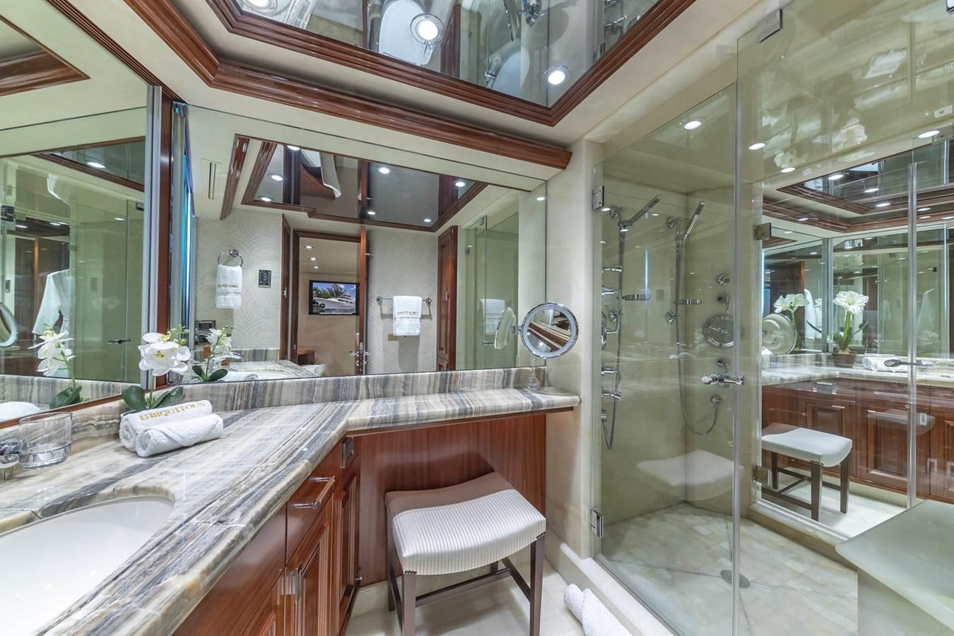a bathroom with a glass shower aboard SIMPLICITY Yacht for Sale