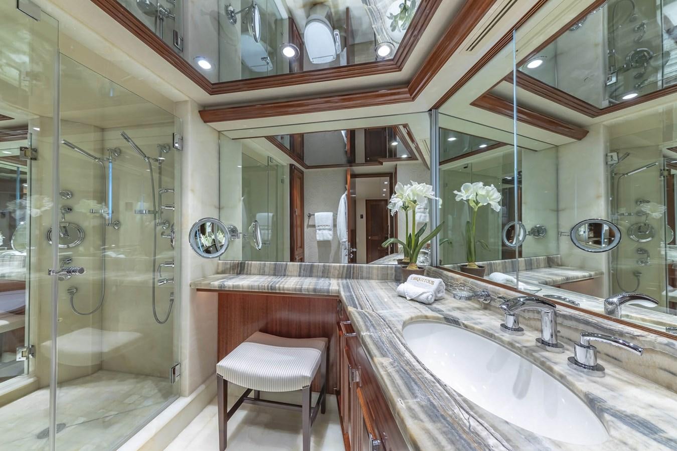 a bathroom with a large mirror aboard SIMPLICITY Yacht for Sale