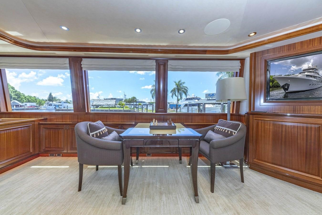 a room with a table and chairs aboard SIMPLICITY Yacht for Sale