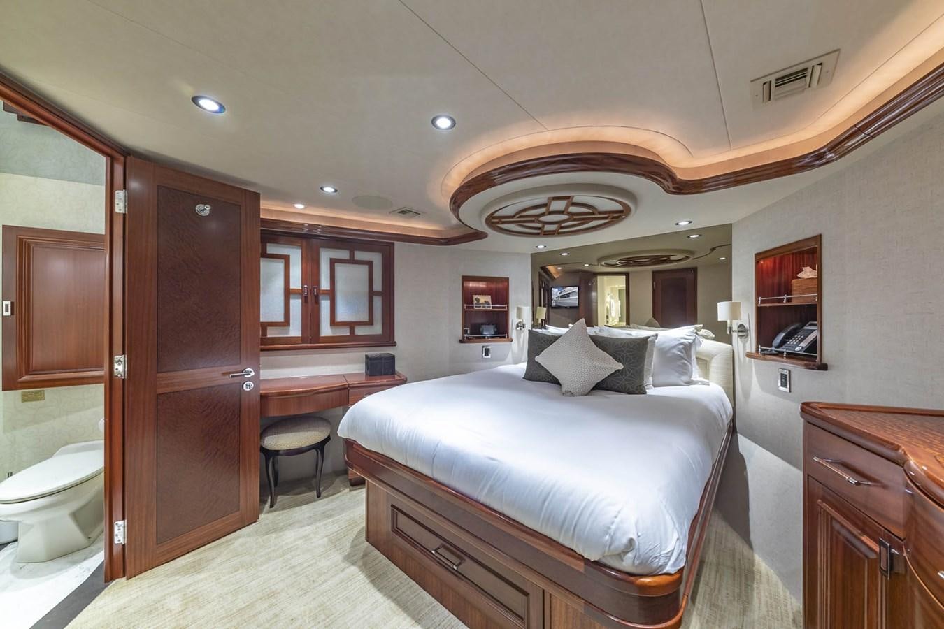a large bedroom with a large bed aboard SIMPLICITY Yacht for Sale