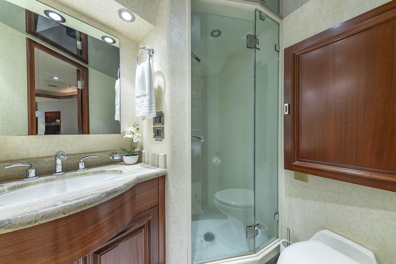 a bathroom with a glass shower door aboard SIMPLICITY Yacht for Sale