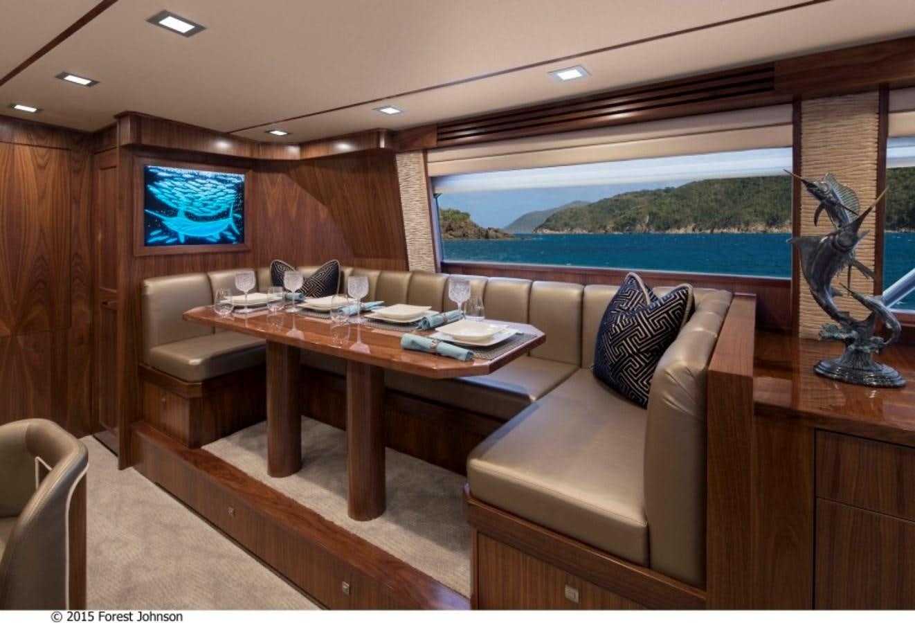 a living room with a large window aboard NEW VIKING 80 SKYBRIDGE Yacht for Sale