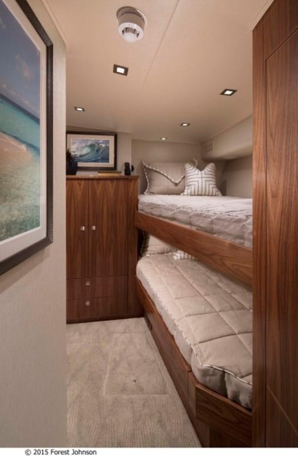 a bedroom with a bed and a television aboard NEW VIKING 80 SKYBRIDGE Yacht for Sale