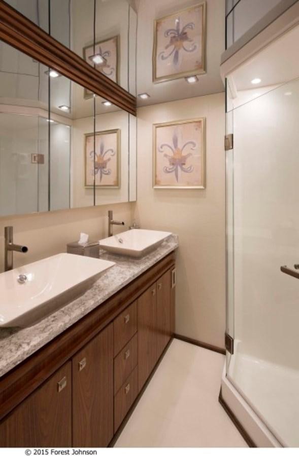 a bathroom with a large mirror aboard NEW VIKING 80 SKYBRIDGE Yacht for Sale