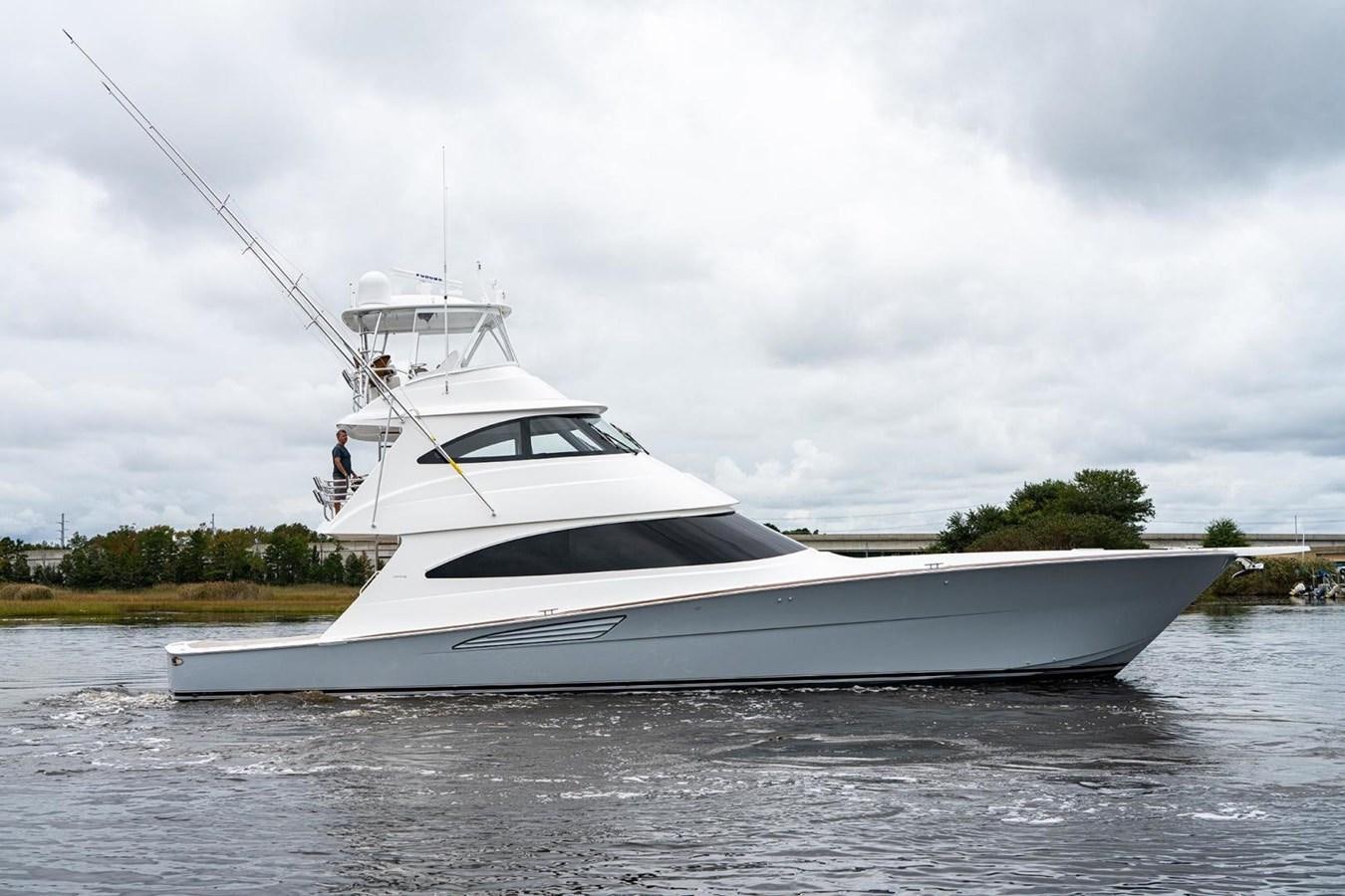 a white yacht on the water aboard NEW VIKING 72 ENCLOSED BRIDGE Yacht for Sale