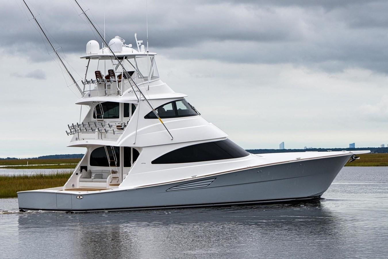 a white yacht on the water aboard NEW VIKING 72 ENCLOSED BRIDGE Yacht for Sale