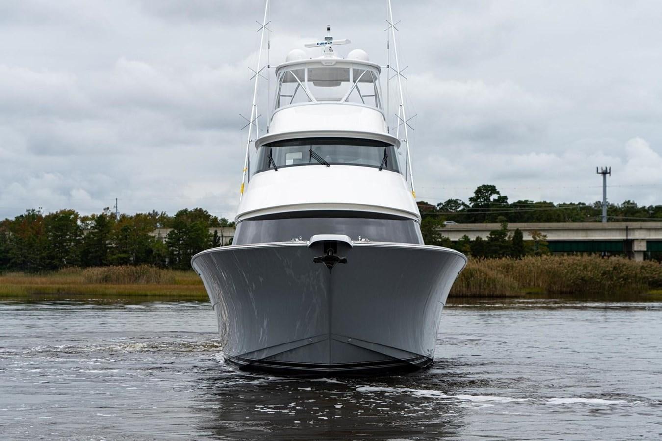 a white boat in the water aboard NEW VIKING 72 ENCLOSED BRIDGE Yacht for Sale
