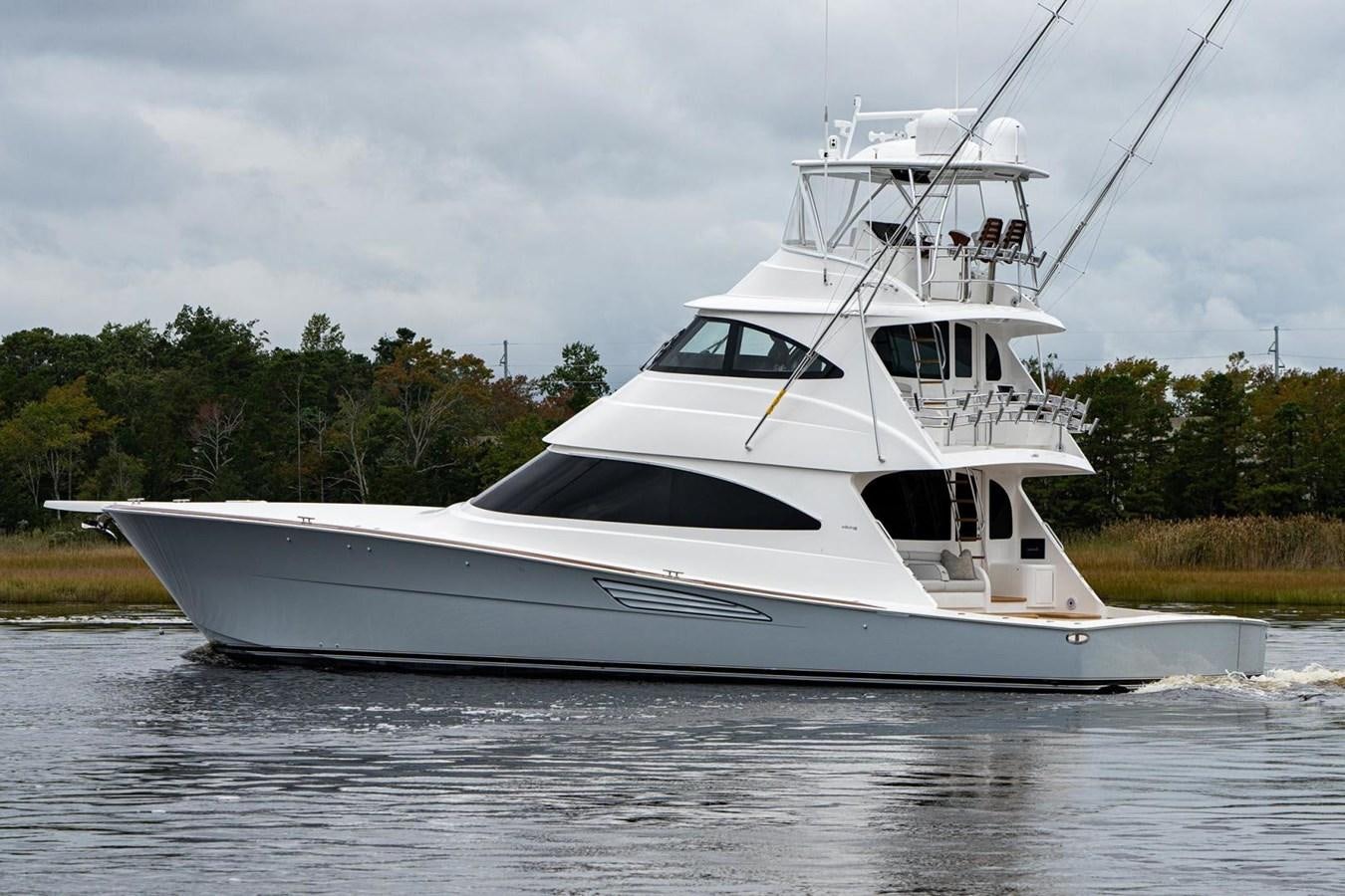 a white yacht on water aboard NEW VIKING 72 ENCLOSED BRIDGE Yacht for Sale