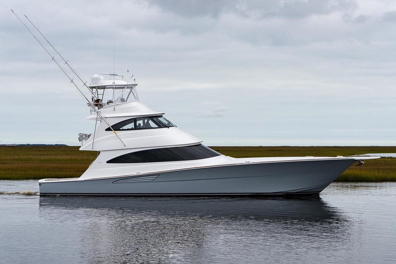 a white yacht in the water aboard NEW VIKING 72 ENCLOSED BRIDGE Yacht for Sale