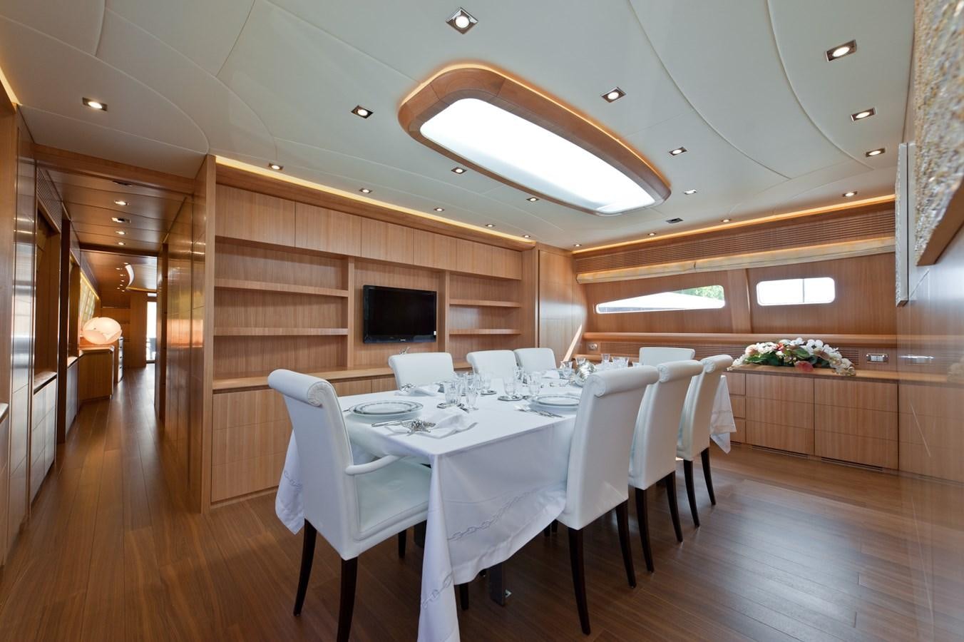 a dining room with a table aboard CYNTHIA Yacht for Sale