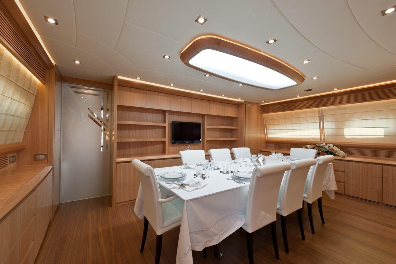 a dining room with white tables aboard CYNTHIA Yacht for Sale