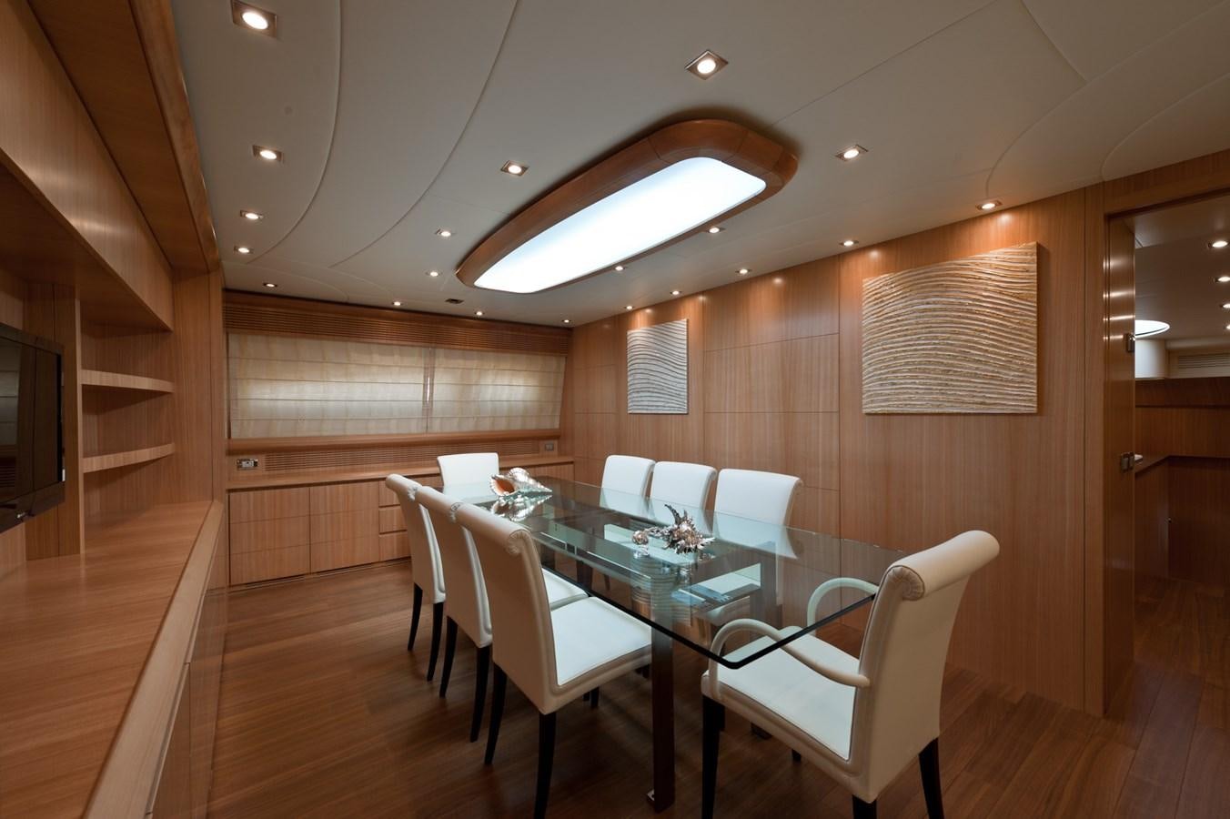 a room with a table and chairs aboard CYNTHIA Yacht for Sale