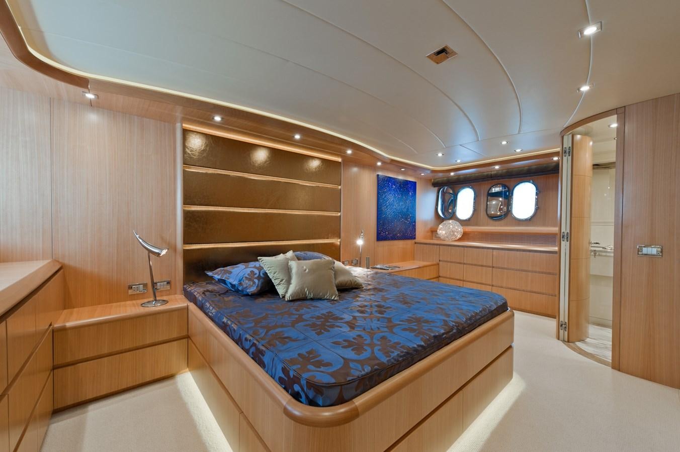 a bed in a room aboard CYNTHIA Yacht for Sale
