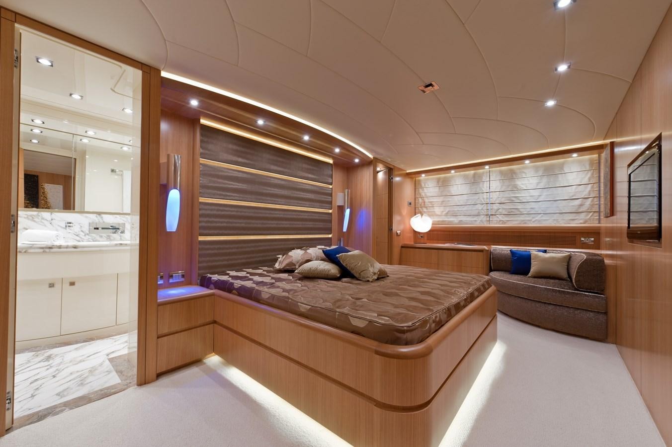 a bedroom with a bed and a couch aboard CYNTHIA Yacht for Sale