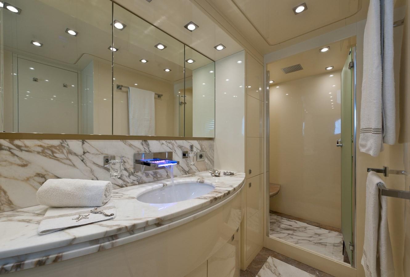 a bathroom with a large mirror aboard CYNTHIA Yacht for Sale