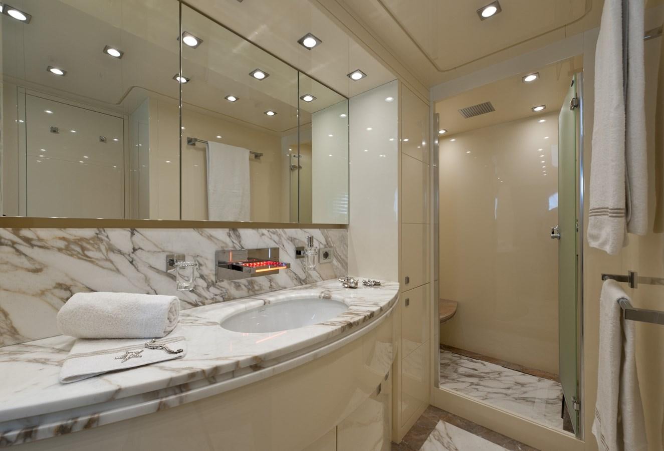 a bathroom with a large mirror aboard CYNTHIA Yacht for Sale