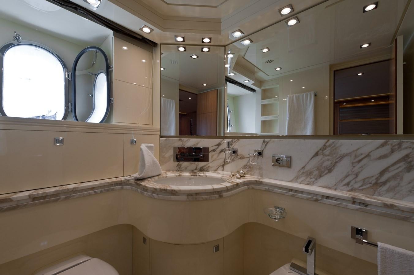 a bathroom with a large mirror aboard CYNTHIA Yacht for Sale