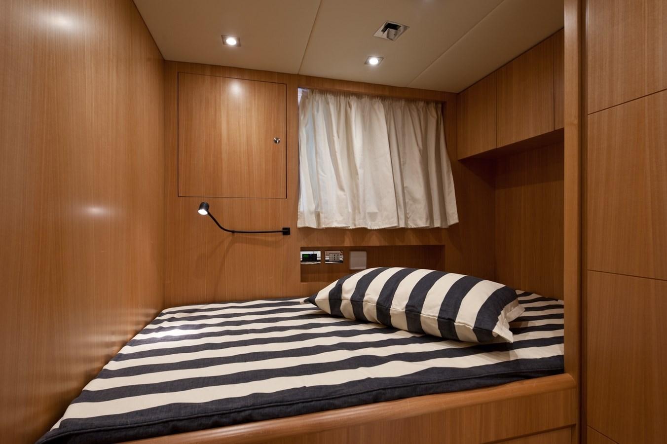 a bed in a room aboard CYNTHIA Yacht for Sale