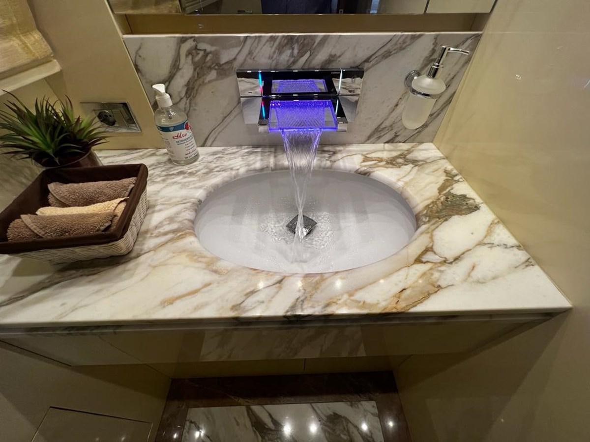 a water fountain in a bathroom aboard CYNTHIA Yacht for Sale