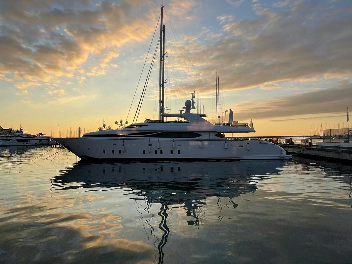 a white boat in a harbor aboard CYNTHIA Yacht for Sale