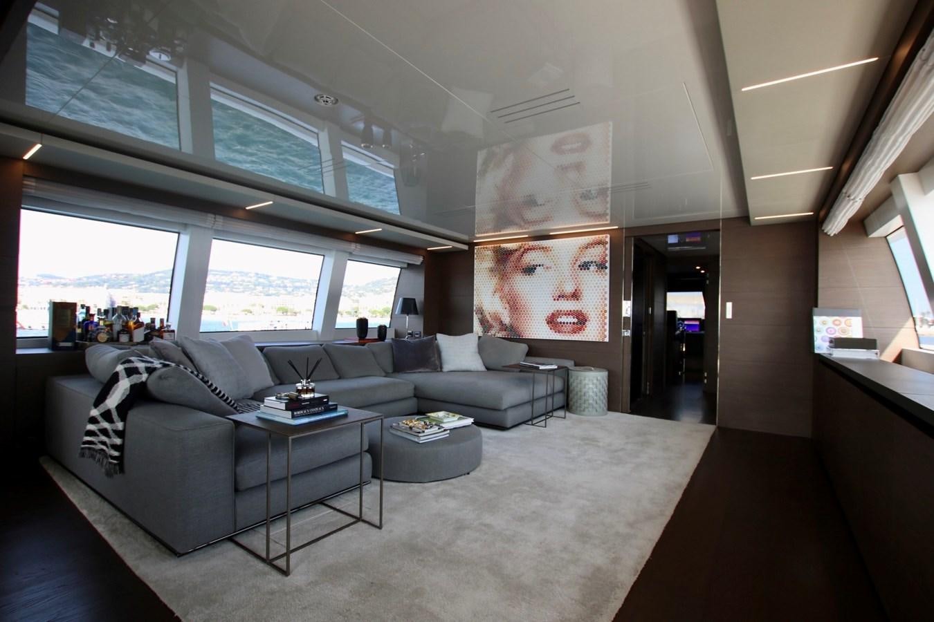 a room with couches and a table aboard WILLPOWER Yacht for Sale
