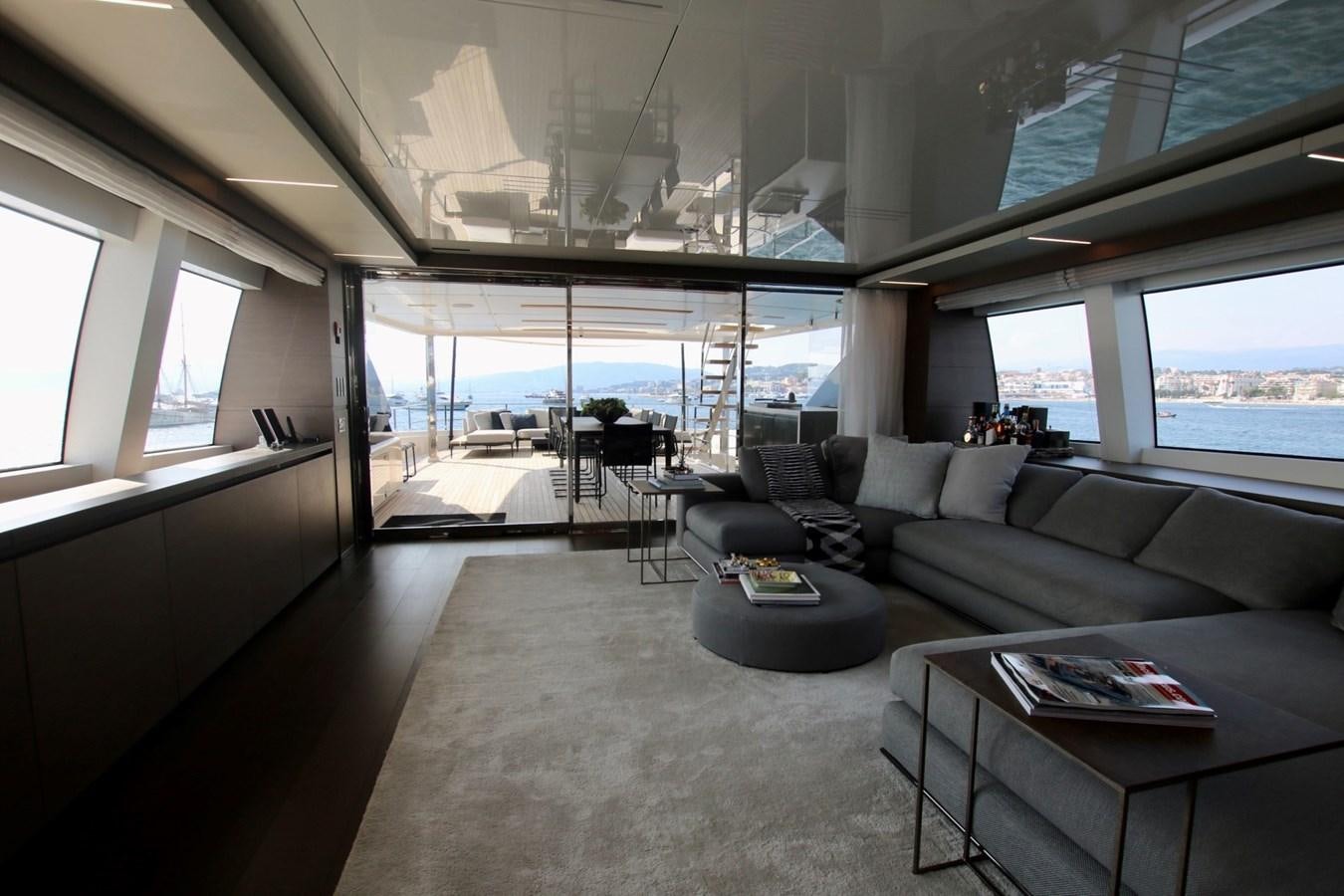 a living room with a large window aboard WILLPOWER Yacht for Sale