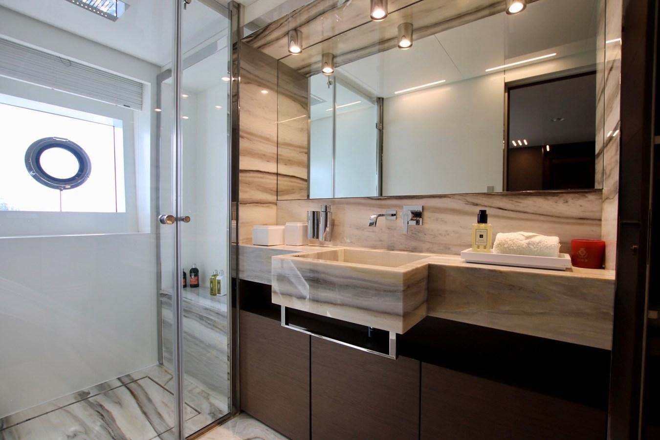a bathroom with a large mirror aboard WILLPOWER Yacht for Sale