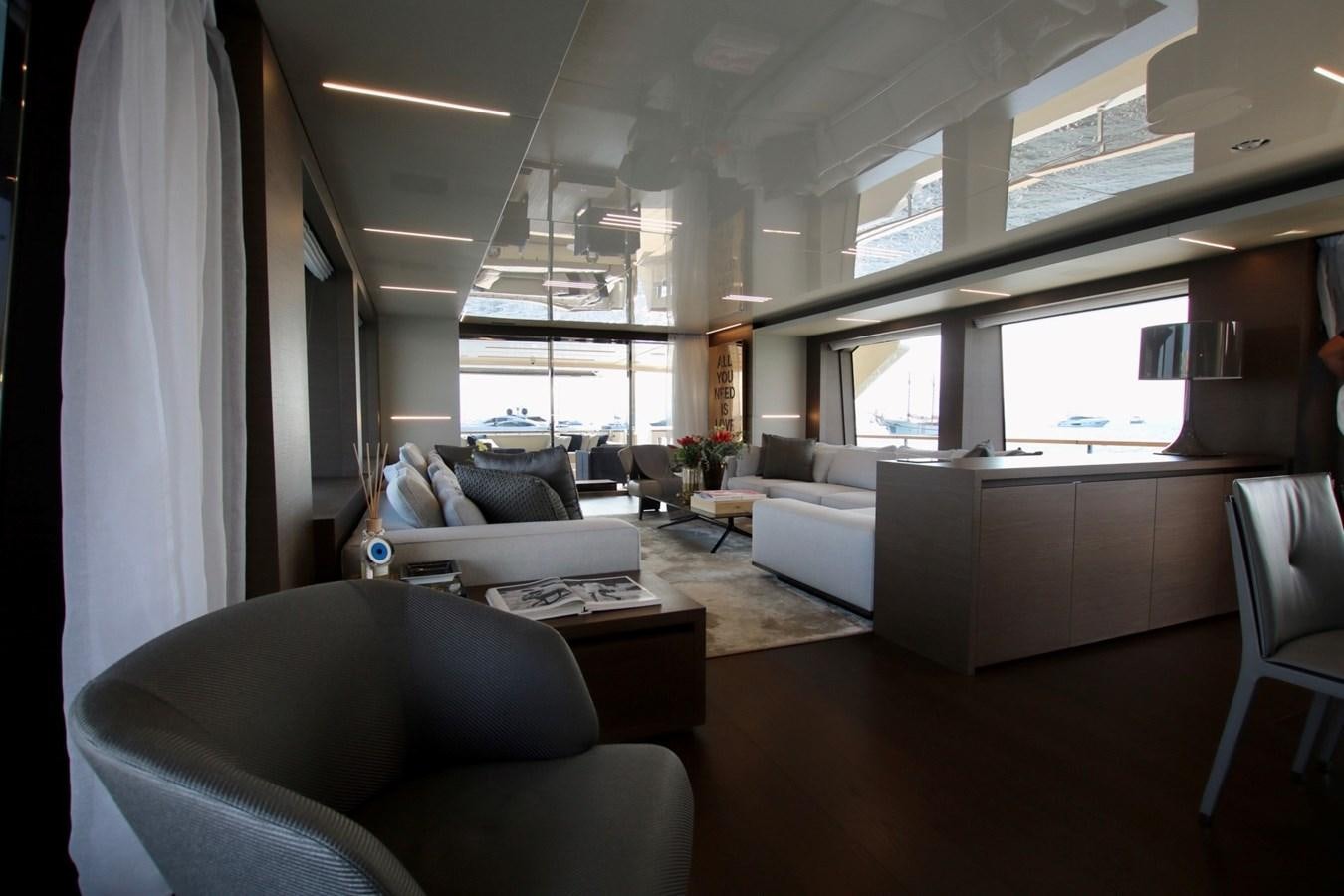 a living room with white furniture aboard WILLPOWER Yacht for Sale