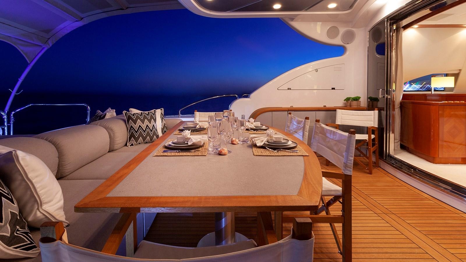 a room with a table and chairs aboard KIDI ONE Yacht for Sale