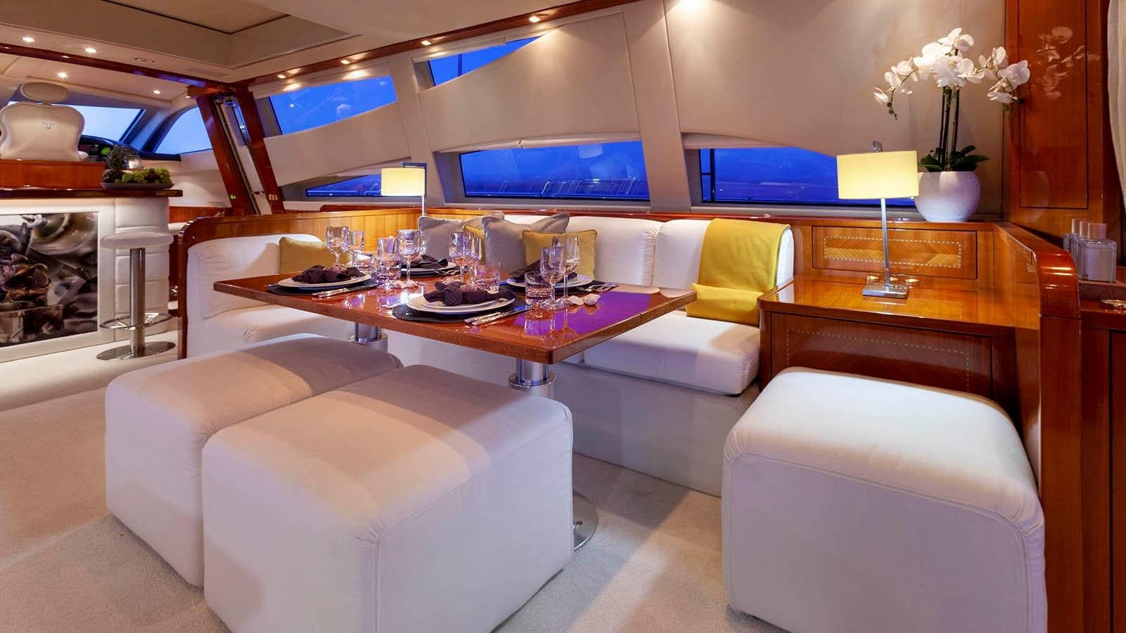 a room with a couch and a table aboard KIDI ONE Yacht for Sale