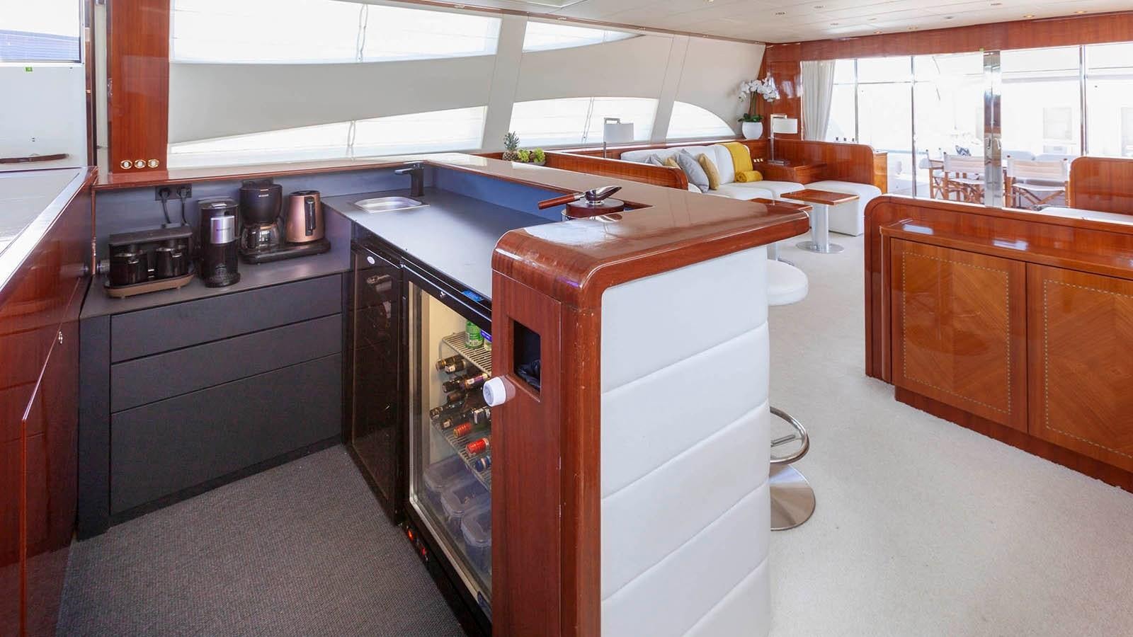 a kitchen with a stove and cabinets aboard KIDI ONE Yacht for Sale