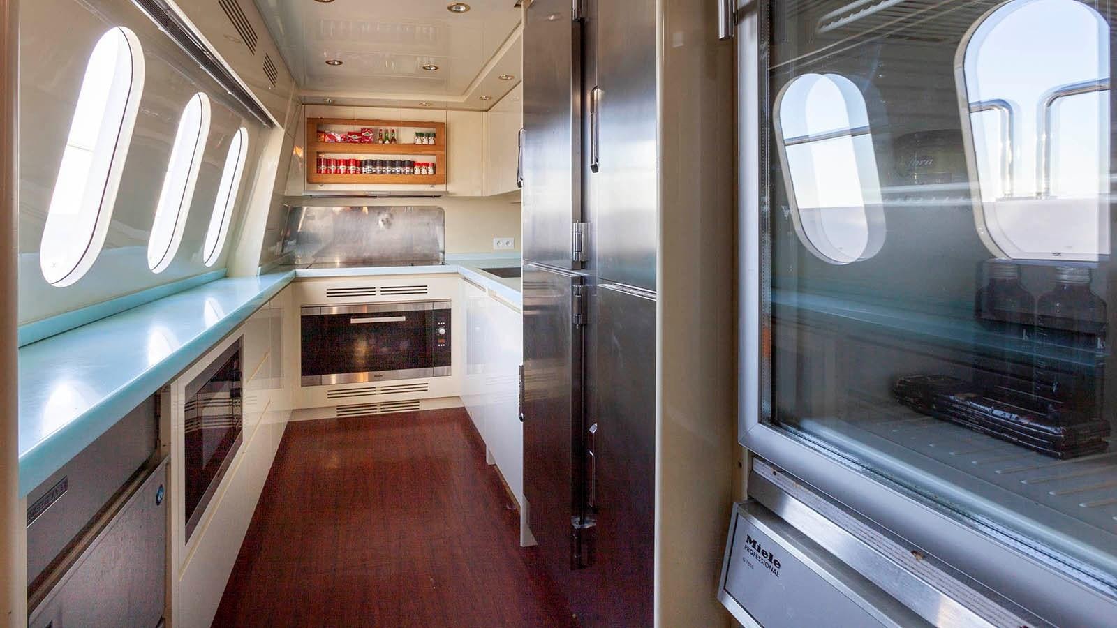 a hallway with a door and windows aboard KIDI ONE Yacht for Sale