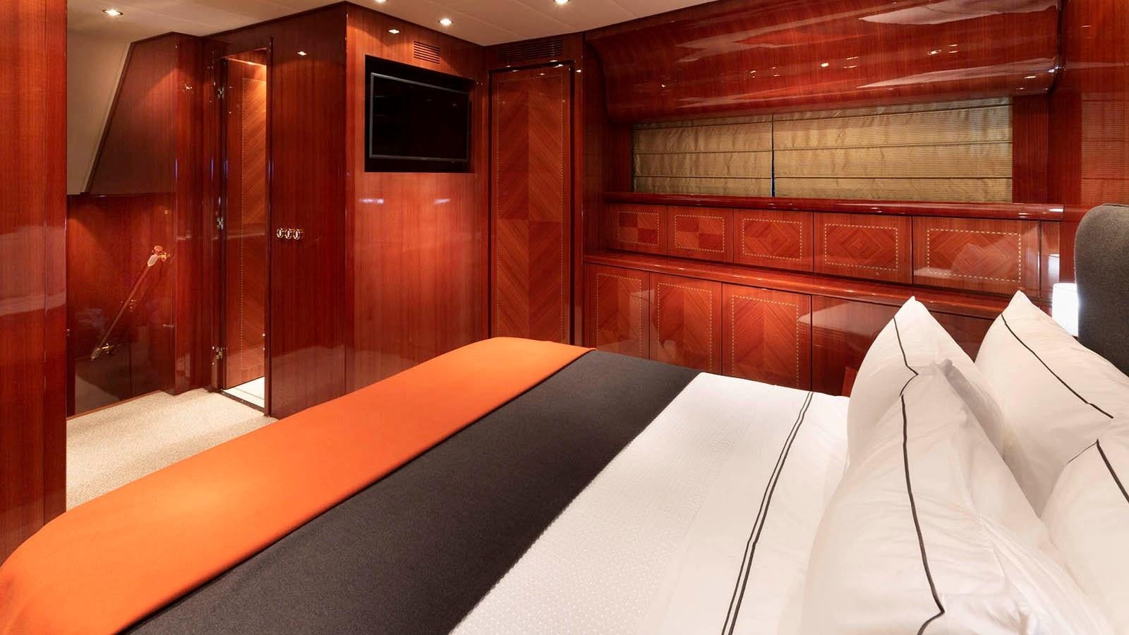 a bed with white sheets aboard KIDI ONE Yacht for Sale